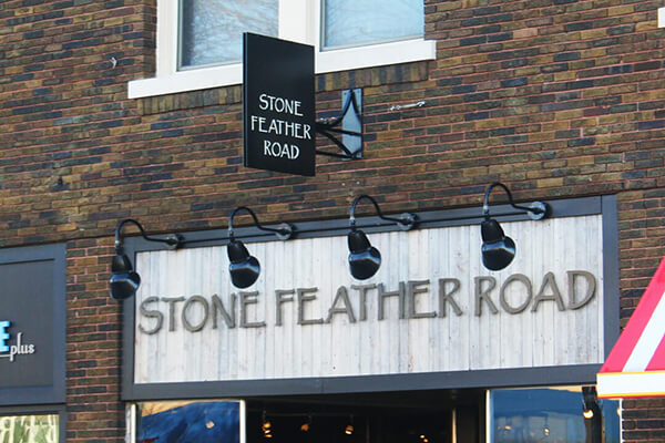 Stone Feather Road Projection Sign
